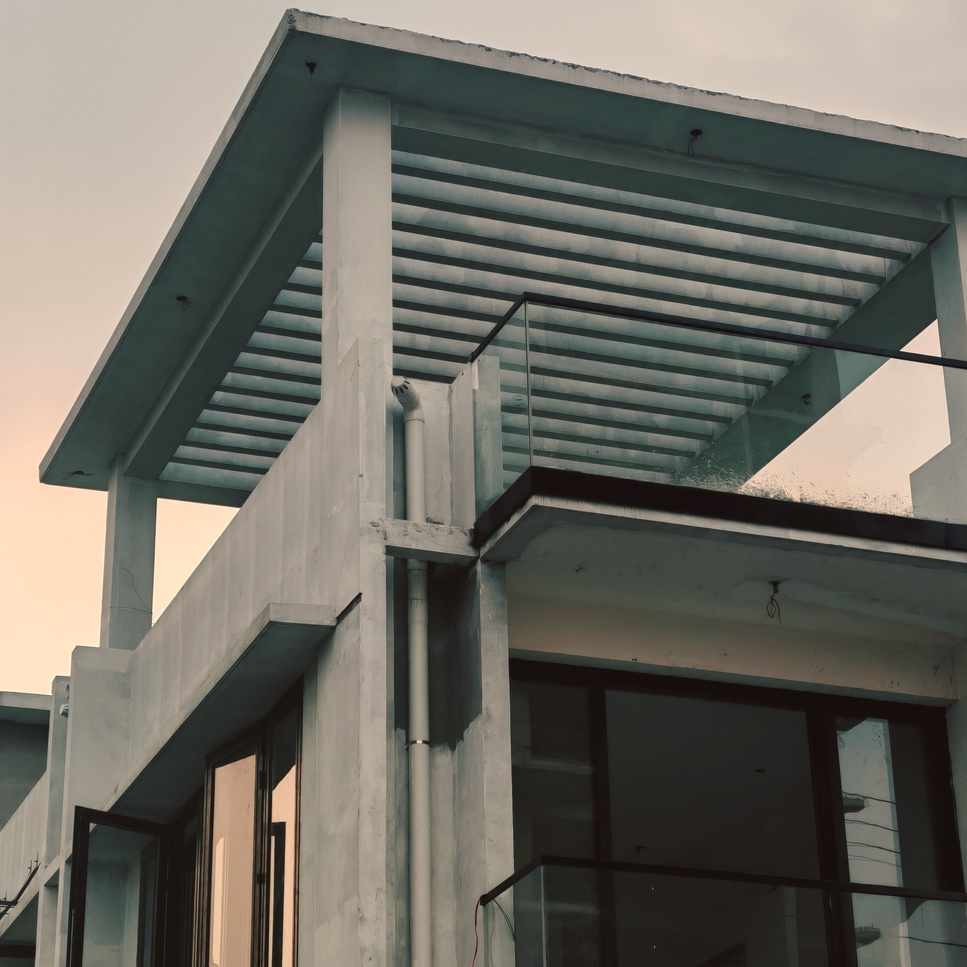 Modern concrete building with glass railings